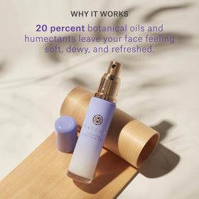 TATCHA bottle among makeup items illustrating use as primer and finishing spray