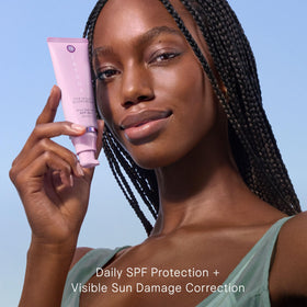 TATCHA sunscreen being dispensed from pump showing easy application