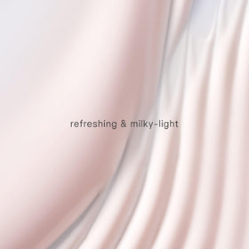 TATCHA milky sunscreen texture close-up demonstrating lightweight spreadability