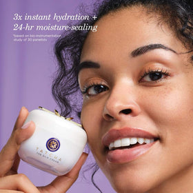 TATCHA cream on fingers demonstrating silky texture and easy absorption