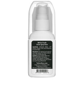 Tattoo Goo bottle in hand showing 2 oz scale for travel-friendly piercing aftercare