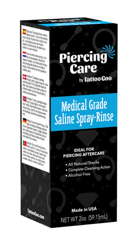 Tattoo Goo spray being used on a piercing to remove discharge and reduce irritation