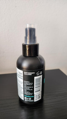 Travel kit with Tattoo Goo bottle demonstrating portability and on-the-go care