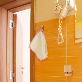 Tatuo cloth in shower scene showing practical everyday exfoliation benefit
