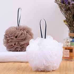 Tbestmax pouf held in hand demonstrating 5.5-inch comfortable size