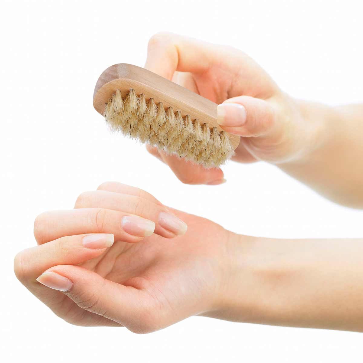 Tbestmax brush held in hand to show size, compact portable design