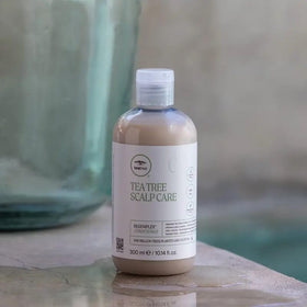 Tea Tree in-shower application on wet hair showing easier combing and reduced breakage