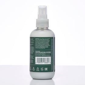 Tea Tree label closeup highlighting panthenol and vitamin E benefits