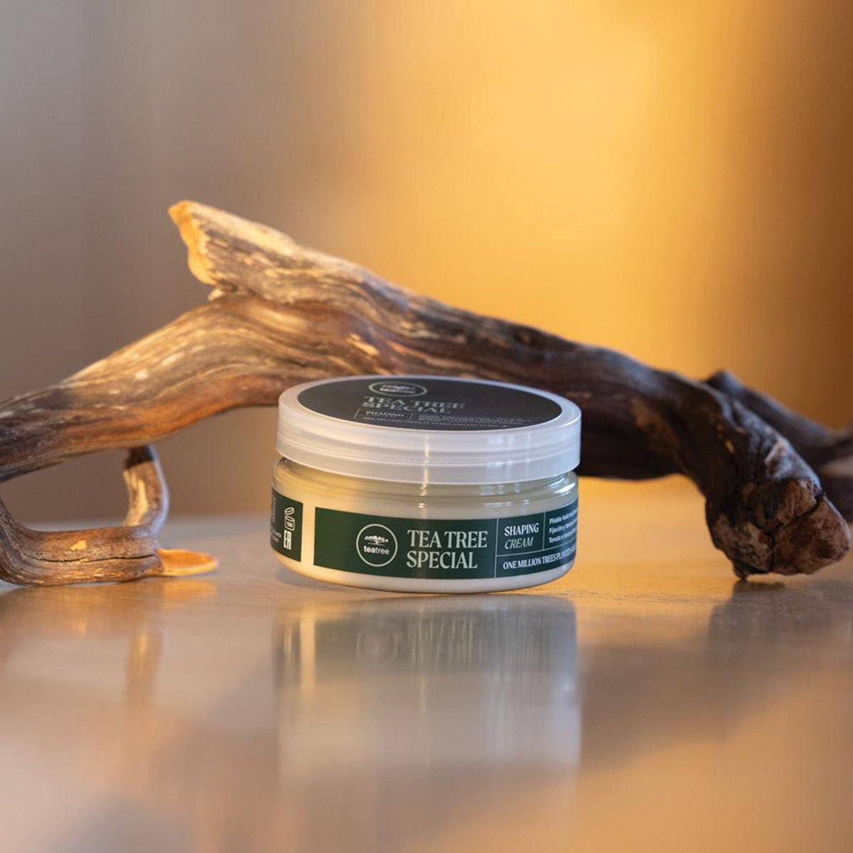 Tea Tree jar next to a ruler for size comparison and portable 3 oz benefit