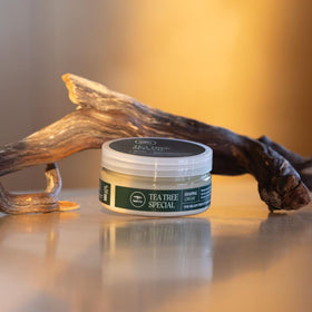 Tea Tree jar next to a ruler for size comparison and portable 3 oz benefit
