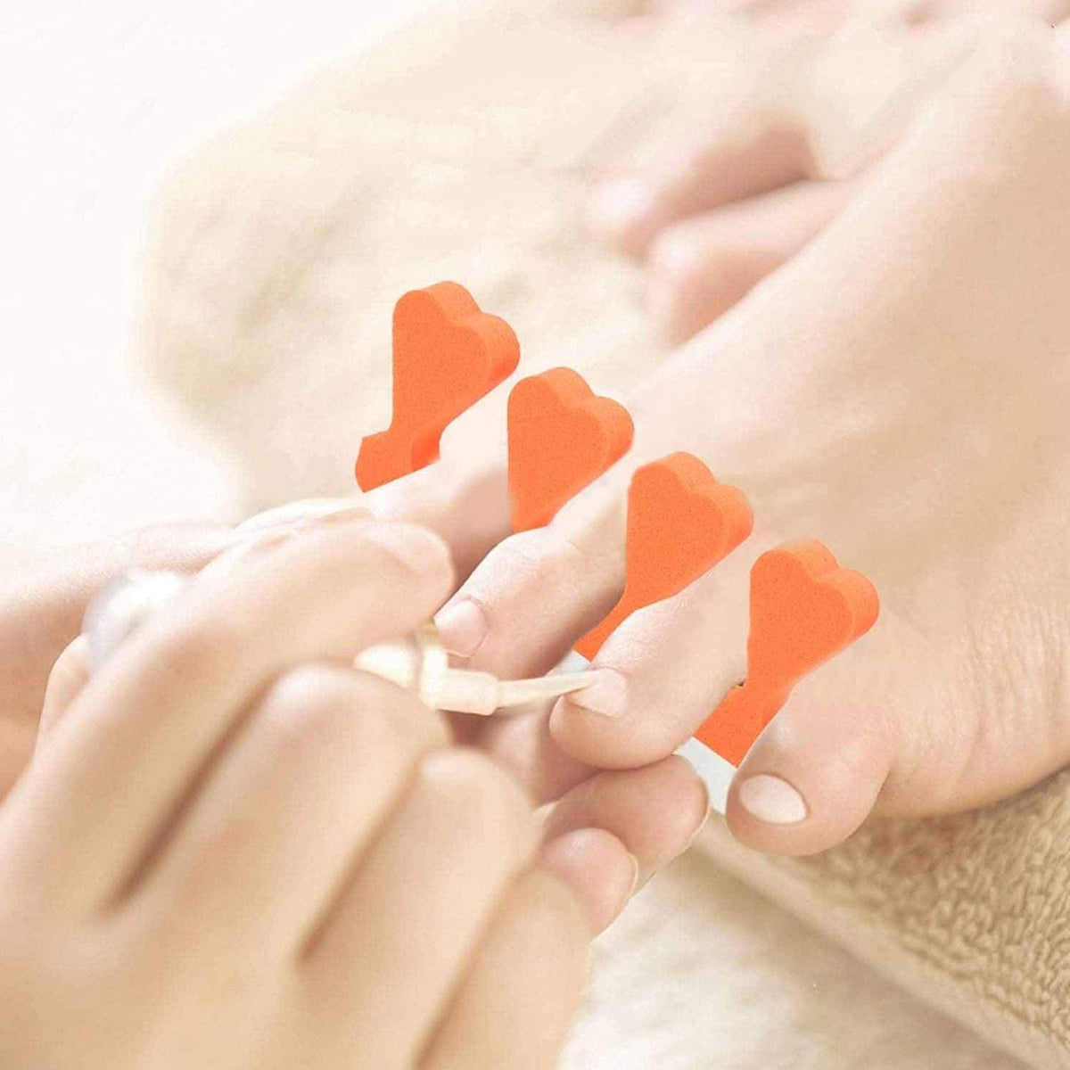 Tecbeauty separator in use during pedicure to prevent polish smudges