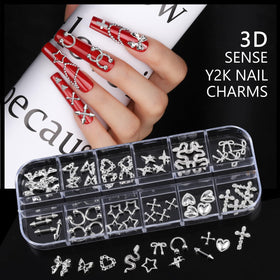 Teenitor close-up of mixed silver charms highlighting detailed shapes and polished finish