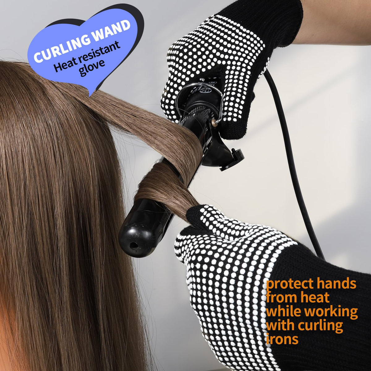 Teenitor glove worn while holding a curling iron for safe styling
