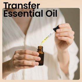 Teenitor glass dropper dispensing essential oil demonstrating controlled single-drop application