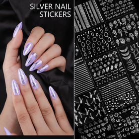 Teenitor finished Y2K-style manicure on hand showcasing striking silver accents
