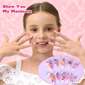 Teenitor small designs next to a coin to show scale and precise sizing for kids' nails