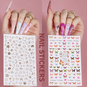 Teenitor nail stickers and rose charms laid out for quick decorating