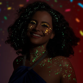 Teenitor under UV black light glowing brightly to highlight neon and fluorescent benefits
