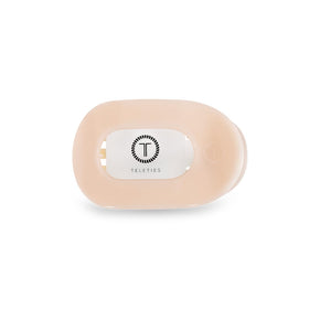 TELETIES flat round clip front view showing compact almond beige design and comfortable hold