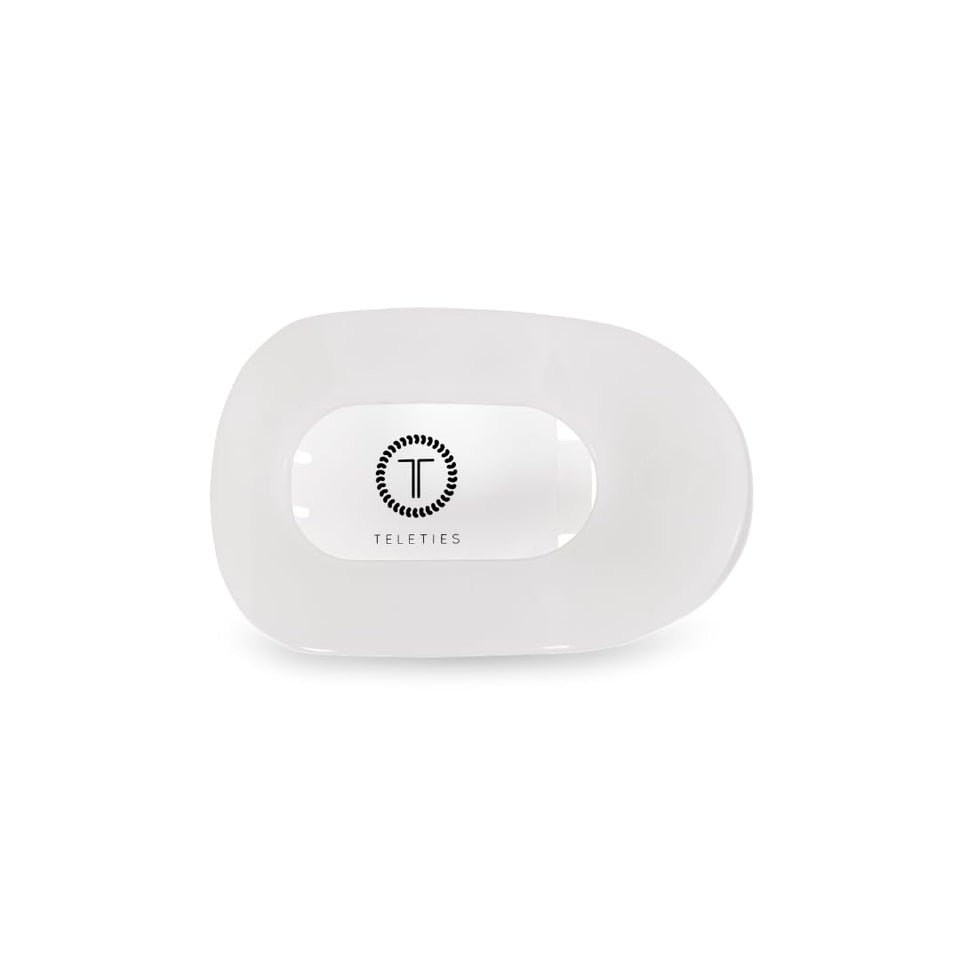 TELETIES flat round clip front view showing low-profile curve and secure hold