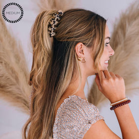 Teleties in use in a half-up hairstyle providing all-day no-slip hold