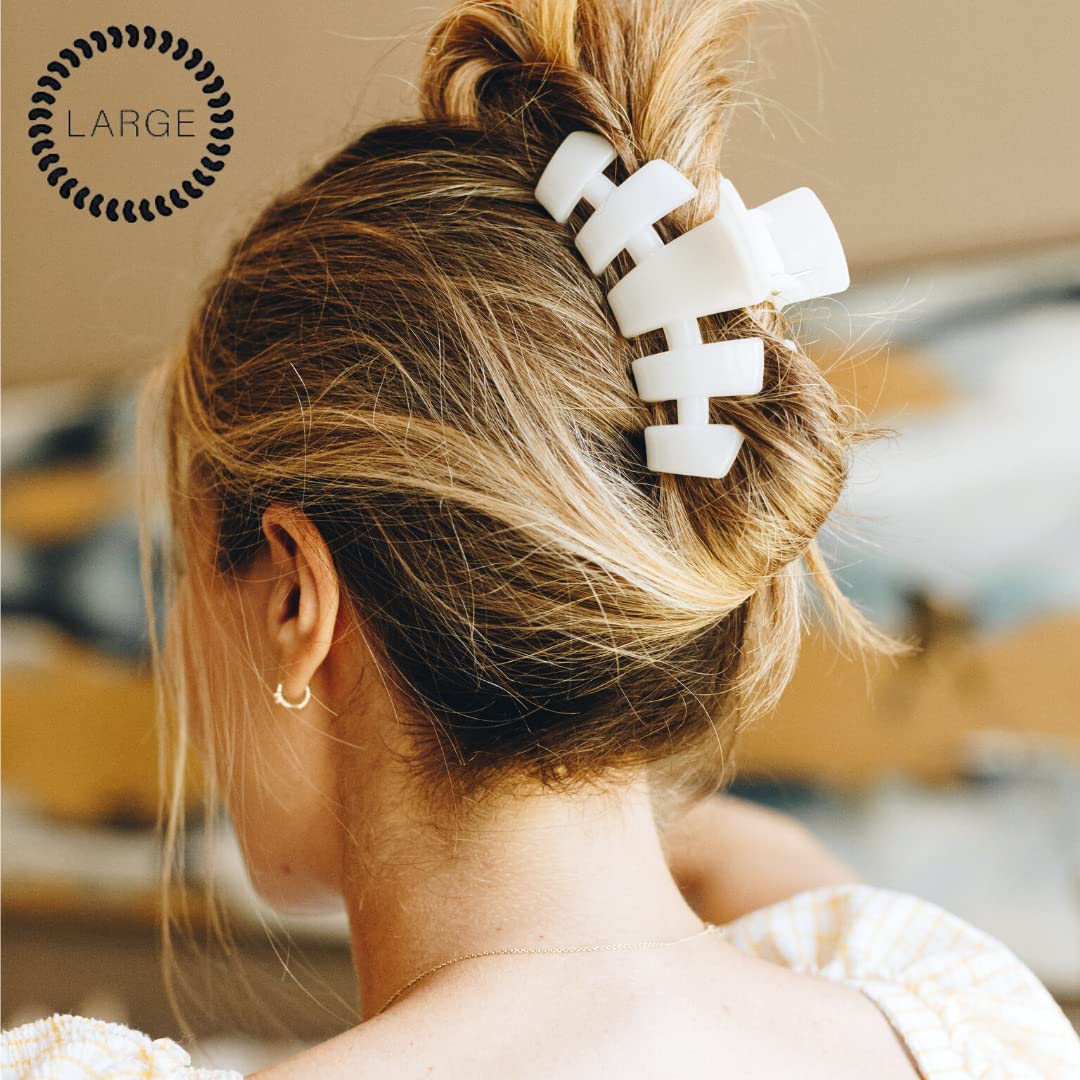 TELETIES clip securing a thick hair updo for reliable all-day wear