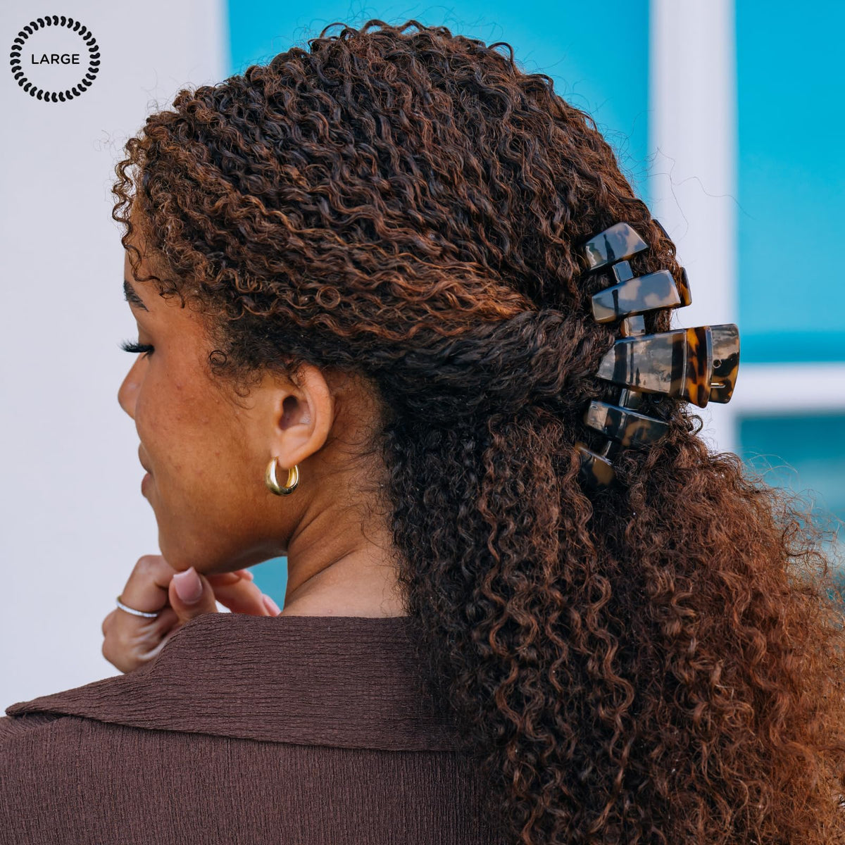 TELETIES clip holding thick hair in an updo for strong all-day hold