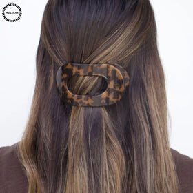 Teleties clip worn during yoga demonstrating secure, comfortable updo