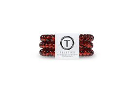 TELETIES tortoise front pack showing three small spiral hair coils and compact packaging benefit ease of storage
