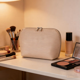 Tense Edano central compartment with skincare bottles demonstrating protected storage