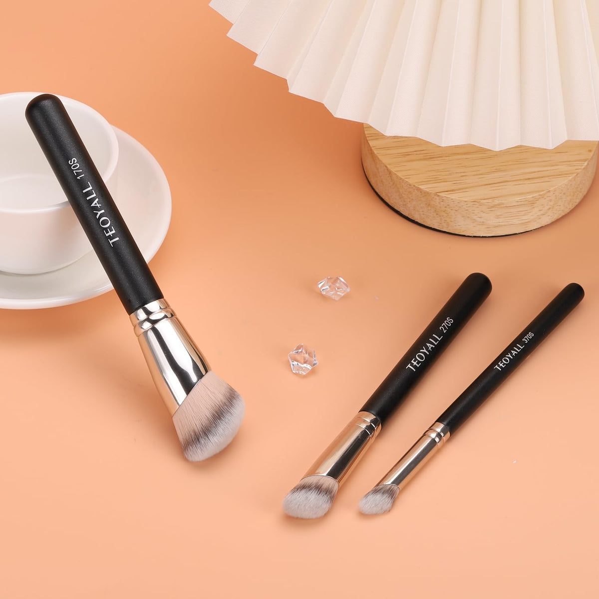 TEOYALL brushes flat lay with foundation and powder showing versatile use with liquid, cream, powder