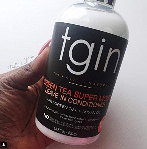 tgin applying leave-in to damp curls to improve detangling ease