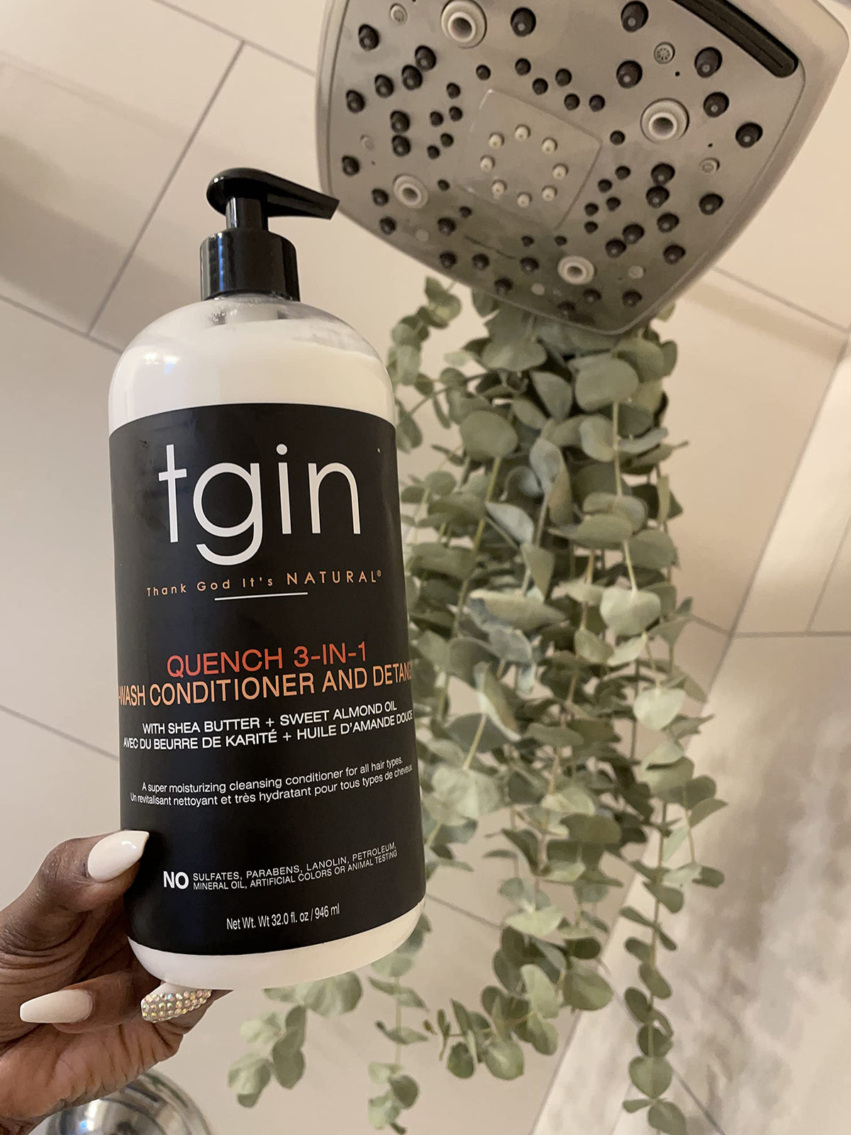 tgin bottle held in hand to show 13 oz scale and travel-friendly size