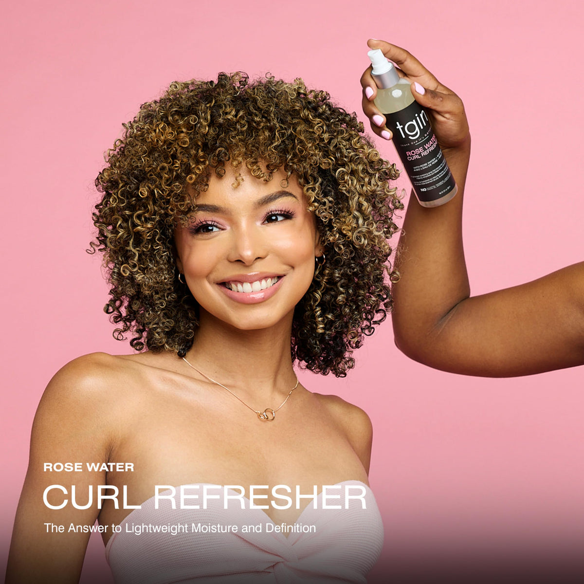 tgin spray mist dispersing over curls for instant refresh