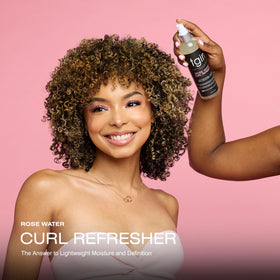 tgin spray mist dispersing over curls for instant refresh