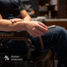 The Art of Shaving lavender tube next to travel kit illustrating portable grooming convenience