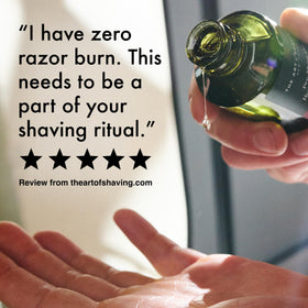 the art of shaving bottle next to ruler showing 8.1 oz scale, clear size reference