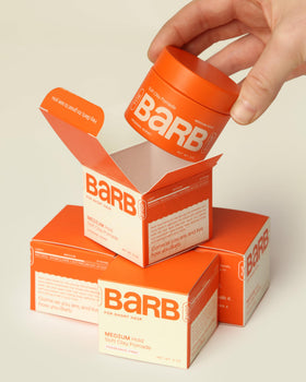 The Barb Shop label close-up highlighting natural waxes and ingredient clarity