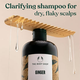 The Body Shop ginger shampoo label close-up highlighting ingredient callouts