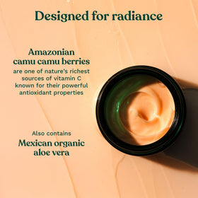 The Body Shop scoop of moisturizer on hand for easy application