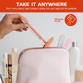 THE GROOMING SOCIETY razor held in hand to show compact size and ergonomic balance