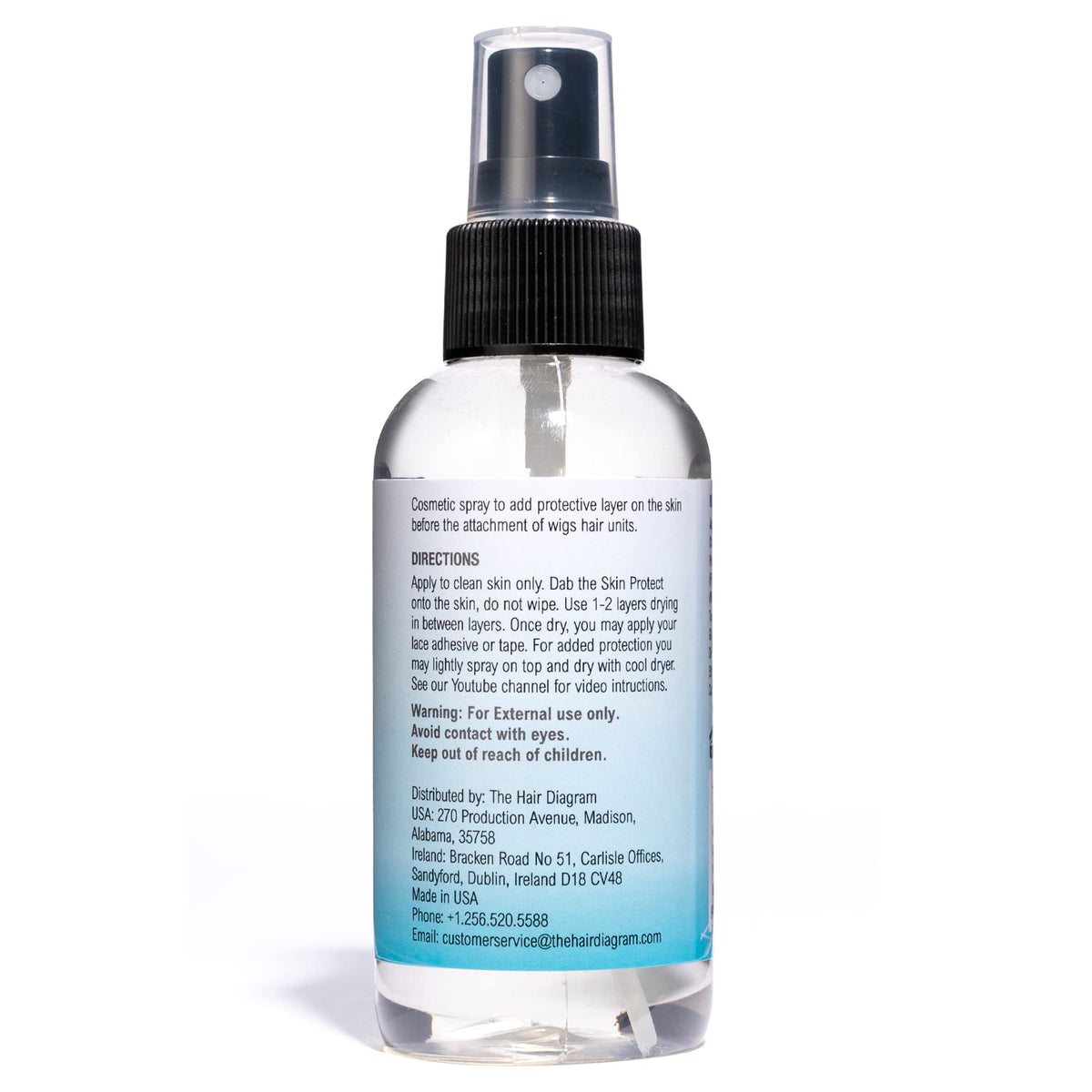 The Hair Diagram applying spray to skin close-up showing fast-drying, non-greasy finish
