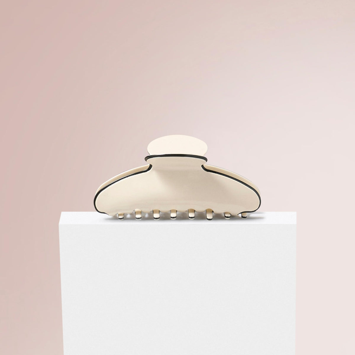 The Hair Edit couture clip held in hand to show 5.3-inch size and scale