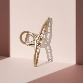 The Hair Edit clip holding a half-up hairstyle for easy everyday styling