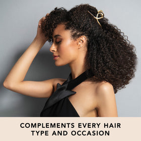 The Hair Edit clip securing a classic French twist updo for a polished look