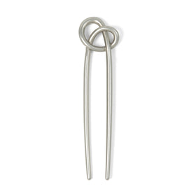 The Hair Edit front view of knotted chignon pin shows elegant secure styling