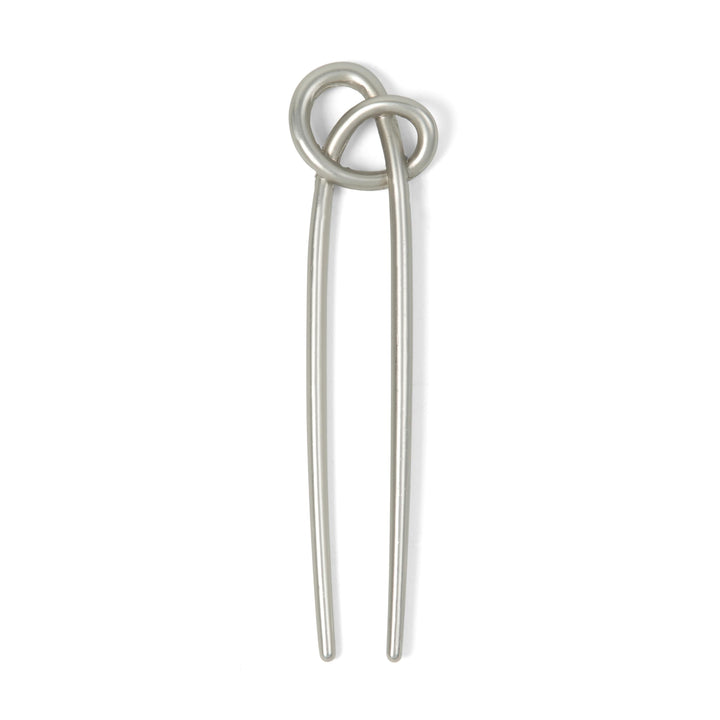 The Hair Edit front view of knotted chignon pin shows elegant secure styling