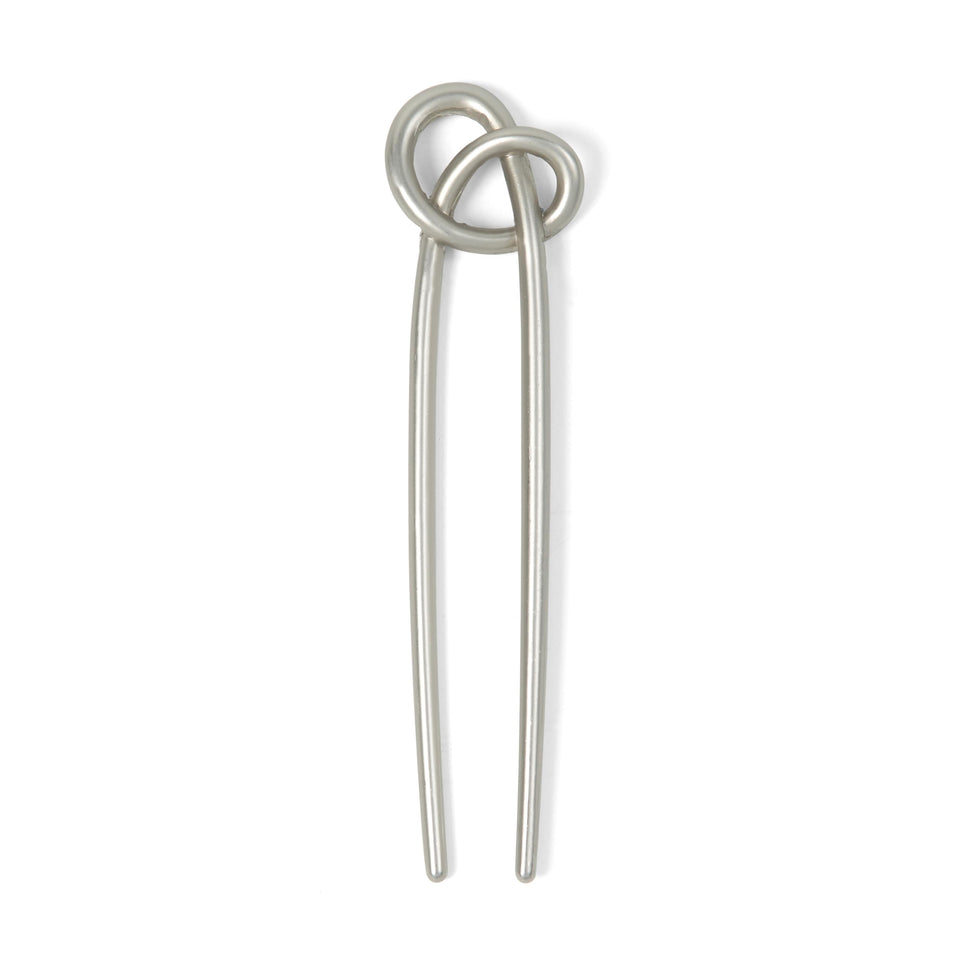 The Hair Edit front view of knotted chignon pin shows elegant secure styling