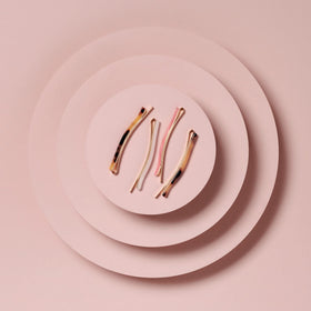 The Hair Edit marble bobby pins packaging flat lay showing four-pack convenience and storage