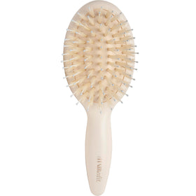 The Hair Edit mini brush front view showing sleek compact design and travel convenience